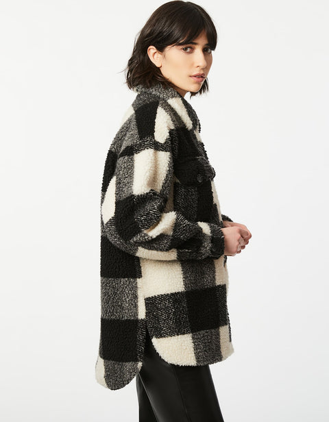 soft knitted checkered button up shirt in black and white made with an oversized collar and slitted sides