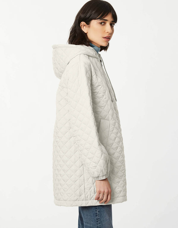 moon glow color lightweight quilted jacket with drawstring hood cinched cuffs and slanted hand pockets as  womens winter cloth