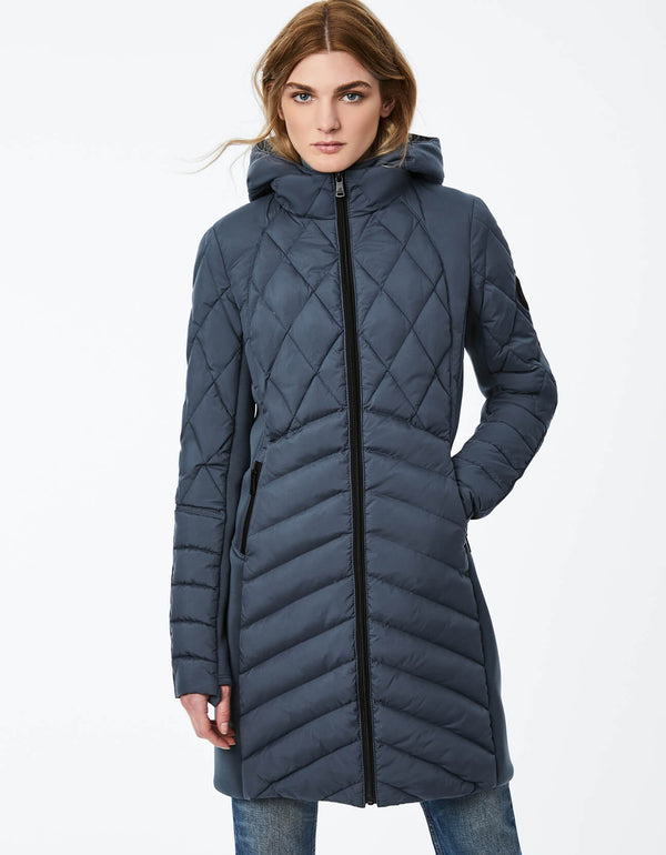 blue hooded puffer jacket for women with a longer paneled design of neoprene and quilted puffer