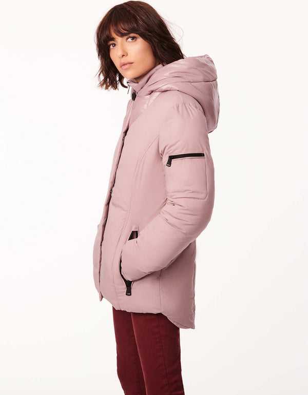multi functional jacket with hood for women in light pink that features an attached inner bib and collar sleeve pocket and inner knit cuff with thumb hole