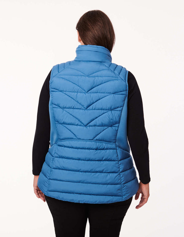 body fitting blue puffer vest for plus sized women with a hidden hood in the collar