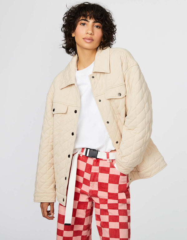cream colored outerwear that is a crossover between a jacket and a shirt from a sustainable online clothing store