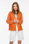 orange oversized hip length puffer jacket for women featuring quilted design and neoprene sleeves and drawstring hood