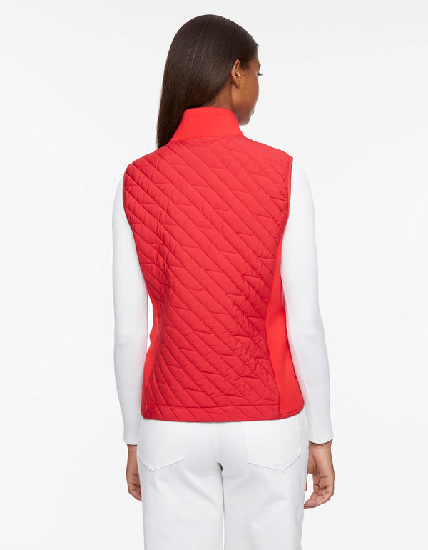womens puffer vest that features neoprene sides for a modern mix of fabrics crafted with quilted texture and sustainable Ecoplume filler