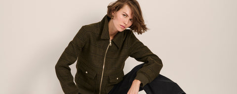 A lady modeling New York City fall fashion in a a cowprint jacket from Bernardo.