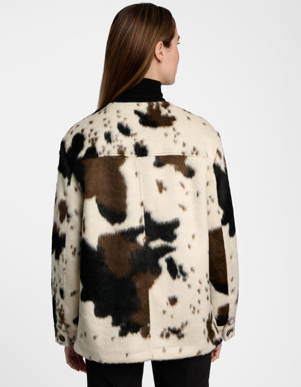 The back of a Dakota Cow Print Utility Jacket from Bernardo Fashions.