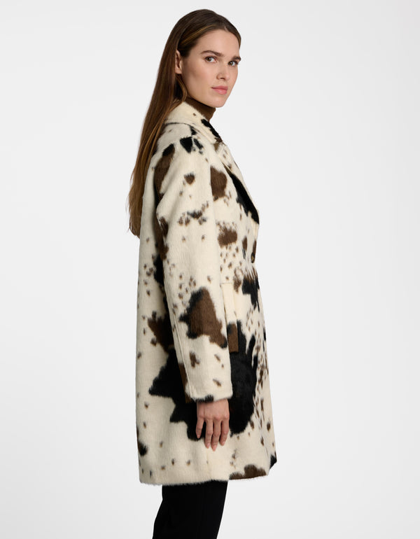 A lady modeling a women's tailored coat this fall from Bernardo.