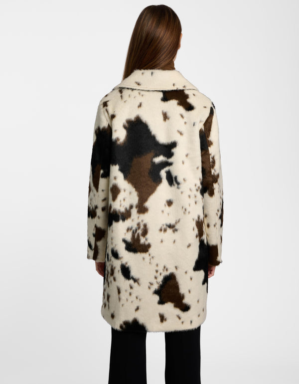 The back of a cow print tailored coat for ladies.