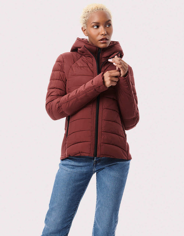 red packable puffer outerwear with zip off vest design and stand collar made from trendy sustainable clothing brand Bernardo Fashions