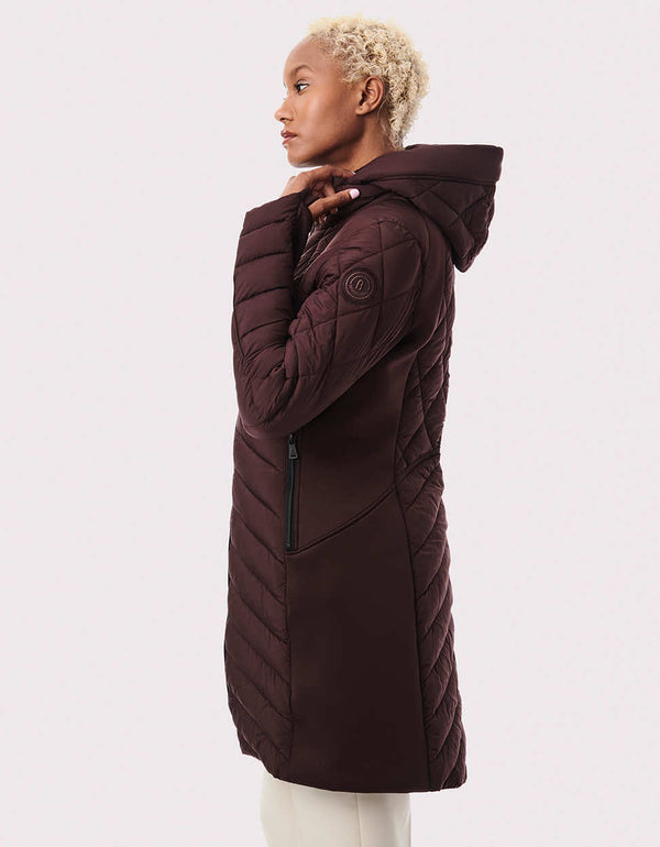 side view of mid length dark violet streamlined puffy jackets for women with superior warmth