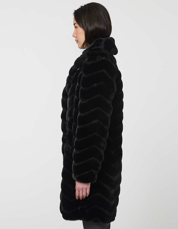 oversized vegan fur coat with tonal zigzag seams and angled hand pockets mid length design