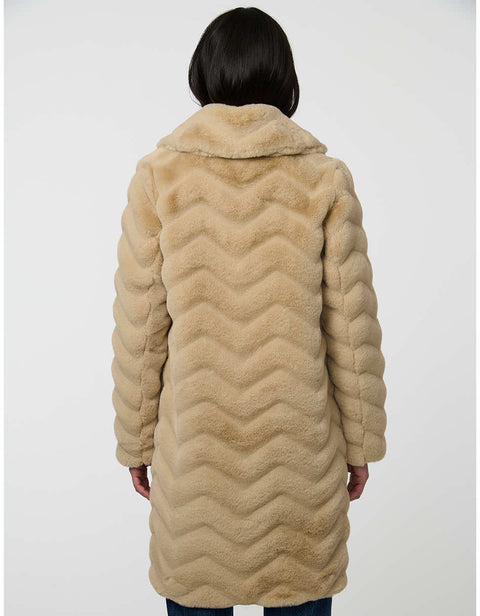 oversized tan vegan fur coat with tonal zigzag seams and angled hand pockets mid length design