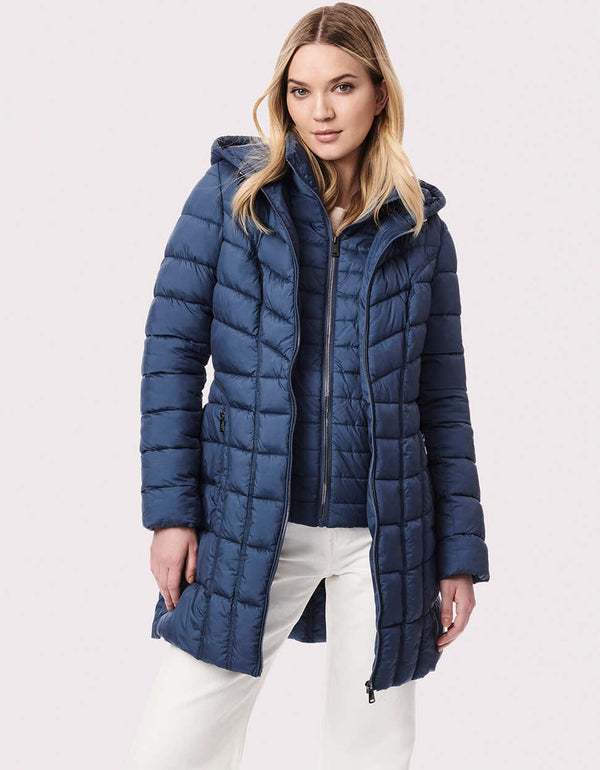 blue three in one puffer coat for women designed with quilted rows and blocks and zip off bib