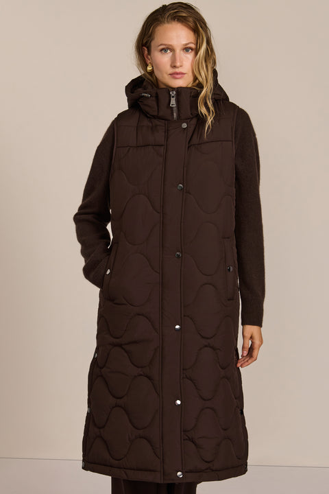 fashionable womans trendy puffer vest in black for winter season in a walker length with oversized fit for comfort