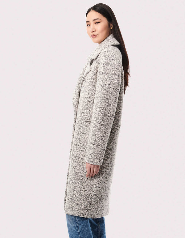 This women's wool coat has an oversized fit and hits below the knees. The extra room makes it a great way to layer for fall and winter.