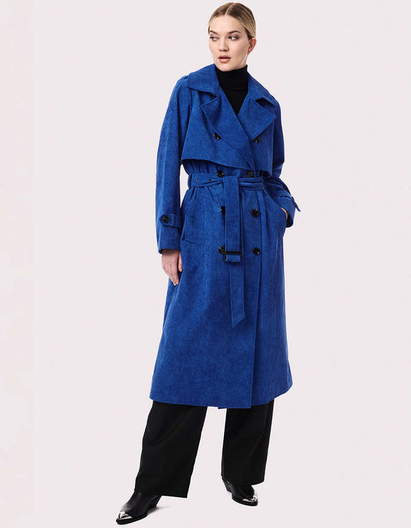 womens big blue statement trench coat made from good corduroy material with buckles at the cuffs