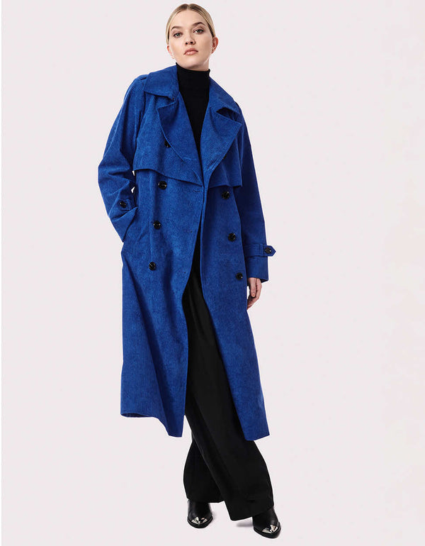 glamorous outerwear with black buttons and long blue belt that features the womans beautiful waist