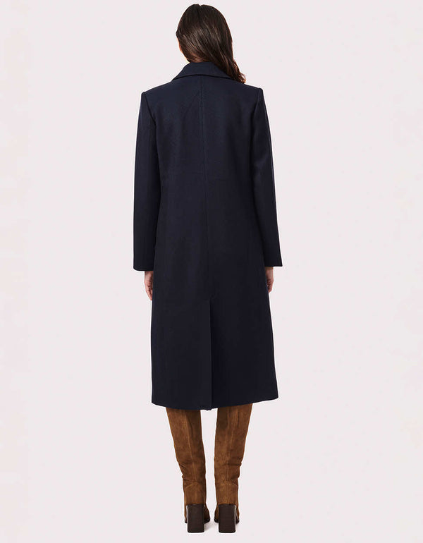 blue long sustainable wool coat with a sharp style statement piece that gives serious vibes