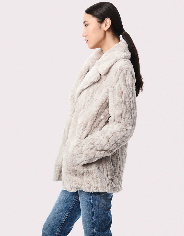 This women's vegan fur jacket provides wintertime warmth that's sumptuously soft and cruelty free.