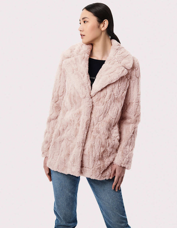 cruelty free faux fur jacket in white for women made from lightweight warm and soft materials for winter wear