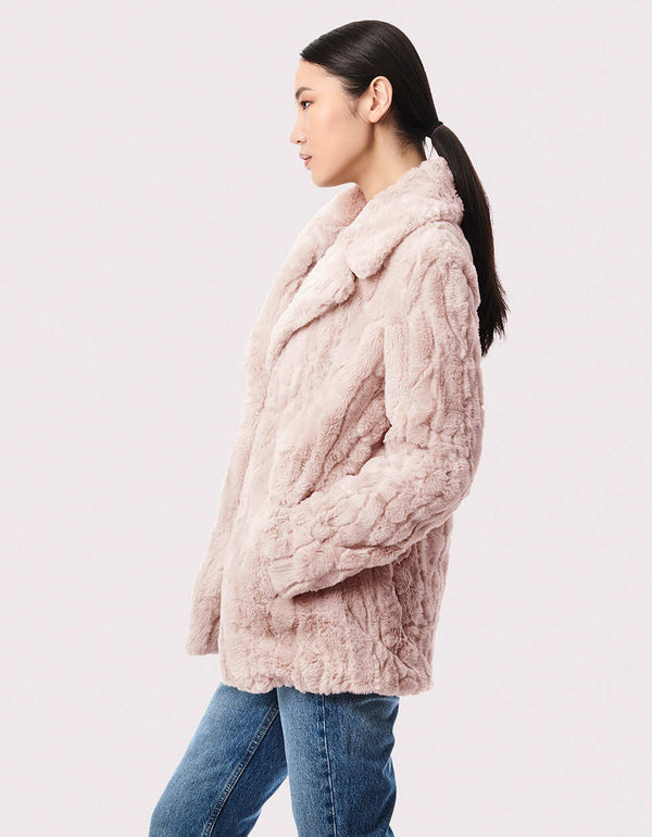 cruelty free faux fur jacket in white for women made from lightweight warm and soft materials for winter wear