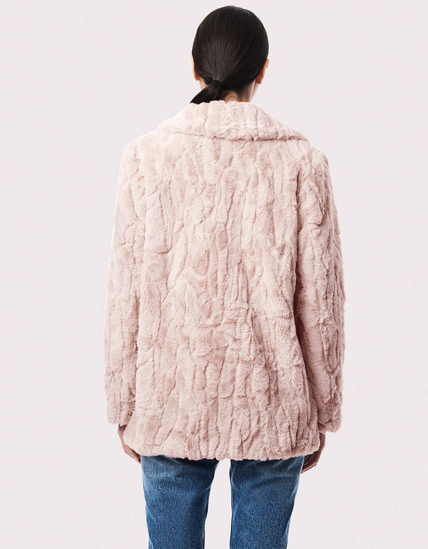 cruelty free faux fur jacket in white for women made from lightweight warm and soft materials for winter wear