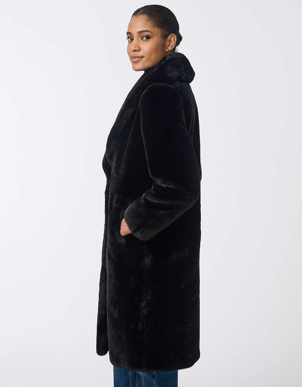 Women's long faux fur coat for an elevated look. Soft plush warmth for day or night.