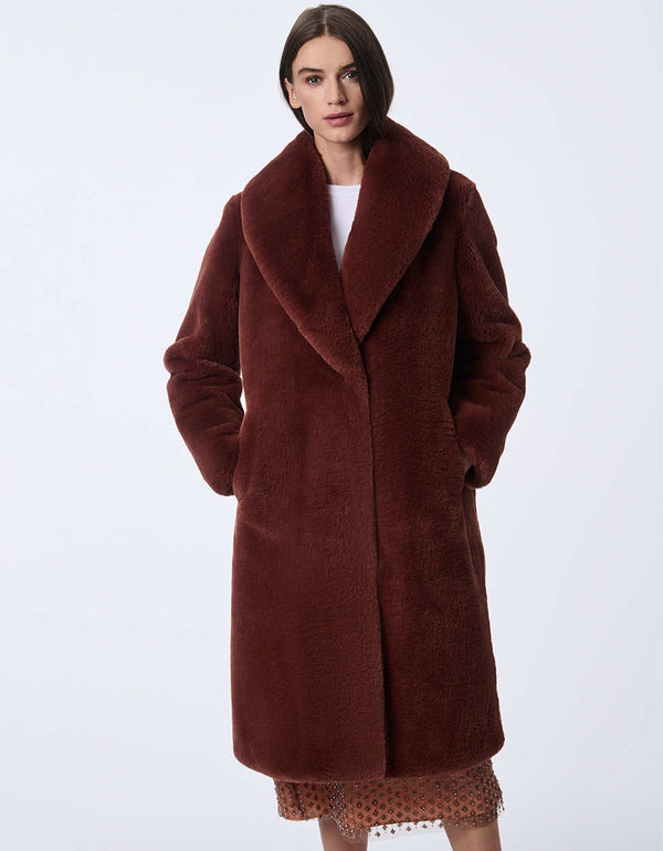 Women's long faux fur coat for an elevated look. Soft plush warmth for day or night.