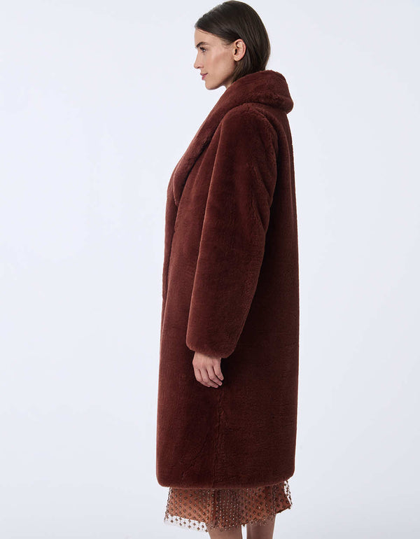 Women's long faux fur coat for an elevated look. Soft plush warmth for day or night.