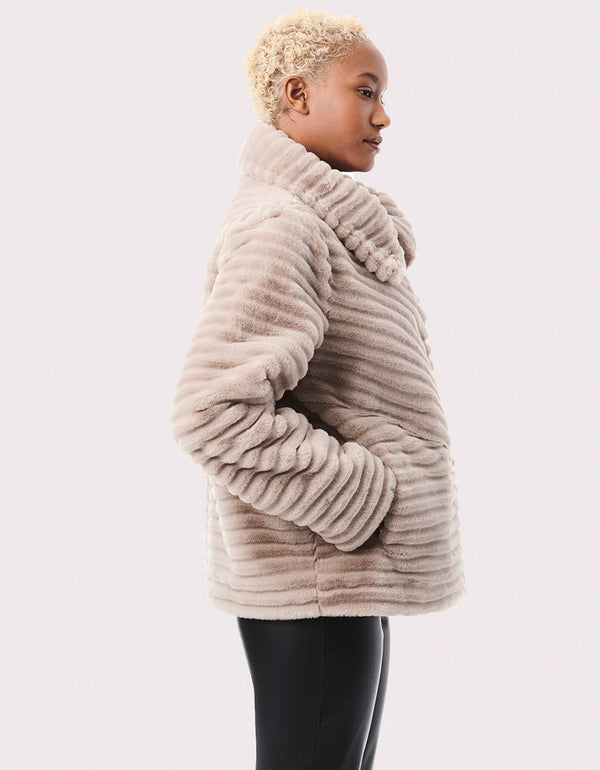 This women's faux-fur jacket is plush and warm for winter with the flattering angles and design lines.