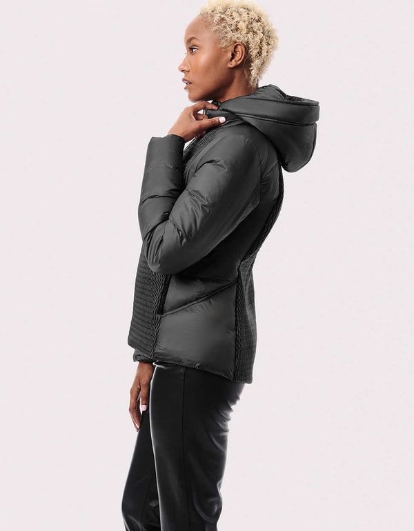 A slim-fit women's puffer jacket that's versatile with a zip-off bib and removable hood.