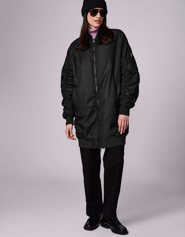 oversized bomber jacket for women with a fashionista street style to outdoor adventure style