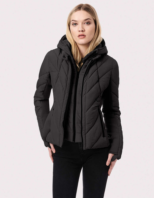 double puffer sustainable jacket with black buttoned high collar double and removable hood for a woman