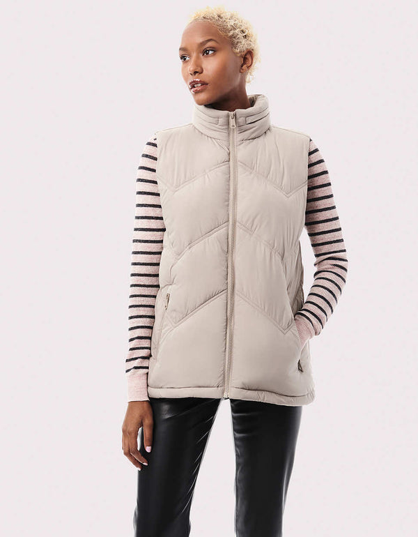 womens chevron quilting classic must have puff layer vest with a hideable hood and insulation made from ecoplume