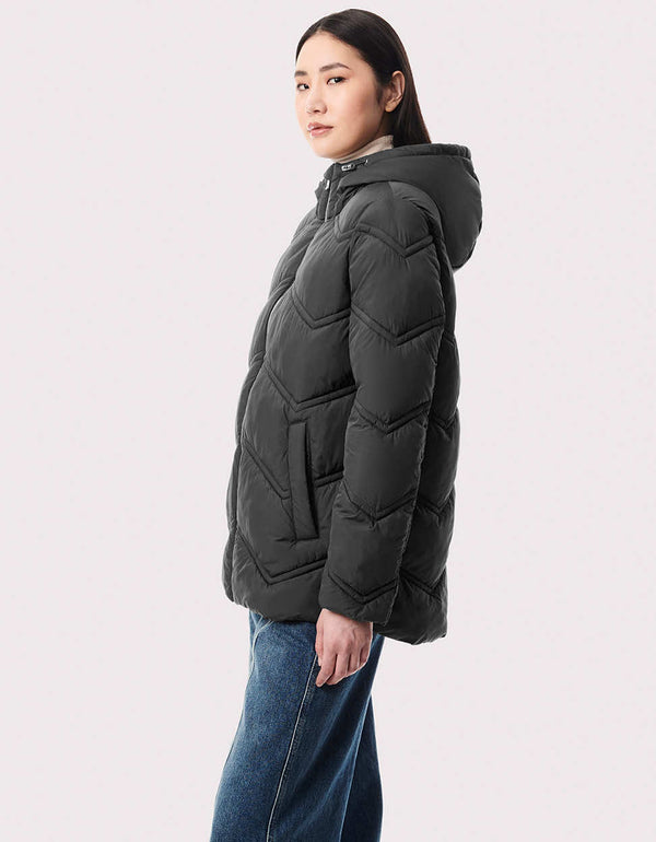 Shop Bernardo women's puffer jackets like this sustainable style with Ecoplume™ insulation. Chevron stitching and a high-low hem define the design.