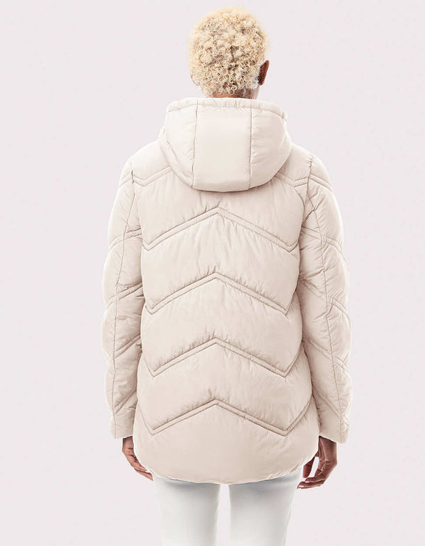 white quilted cruelty free modern jacket that is good to wear during fall and winter season