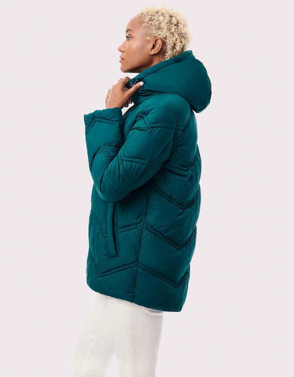 clothes needed for winter hooded blue green puffer jacket for women made by ethical sustainable brand