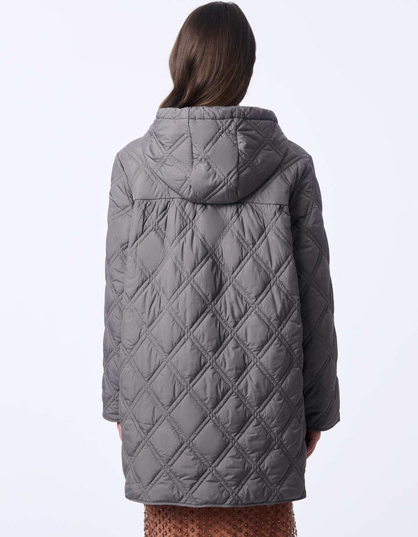 oversized thin puffer jacket with enlarged hood and button up enclosure for women in the fall