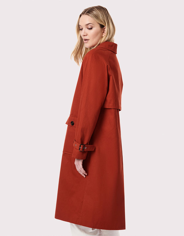 attractively posh and oversized rust colored long utility outercoat with double duty pockets for ladies
