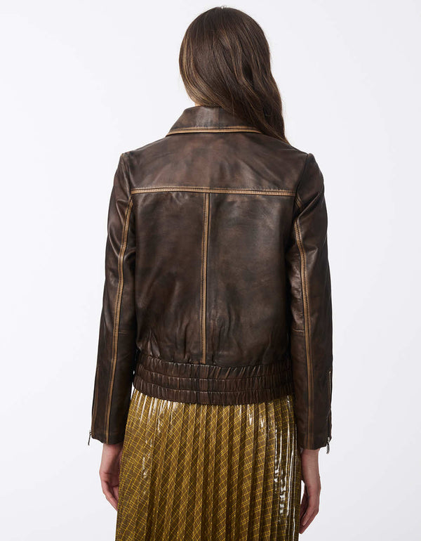 brown leather aviator jacket with cuff zippers and a relaxed fit perfect for elevating a simple casual outfit