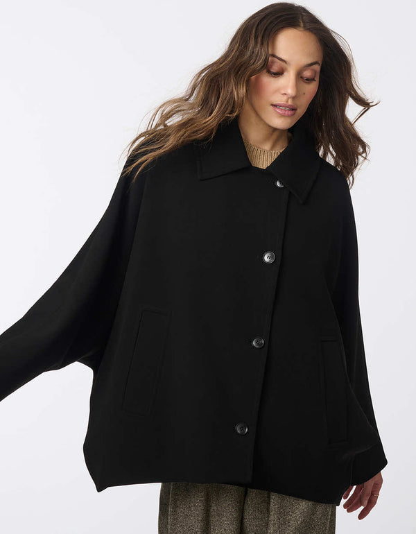 fully button up oversized wool coat with an open collar and two pockets made from wool and batwing sleeves for women