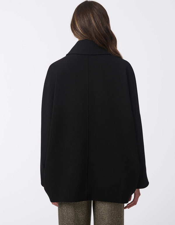 elegant black wool coat with batwing sleeves and a roomy oversized silhouette perfect for comfort and fashion