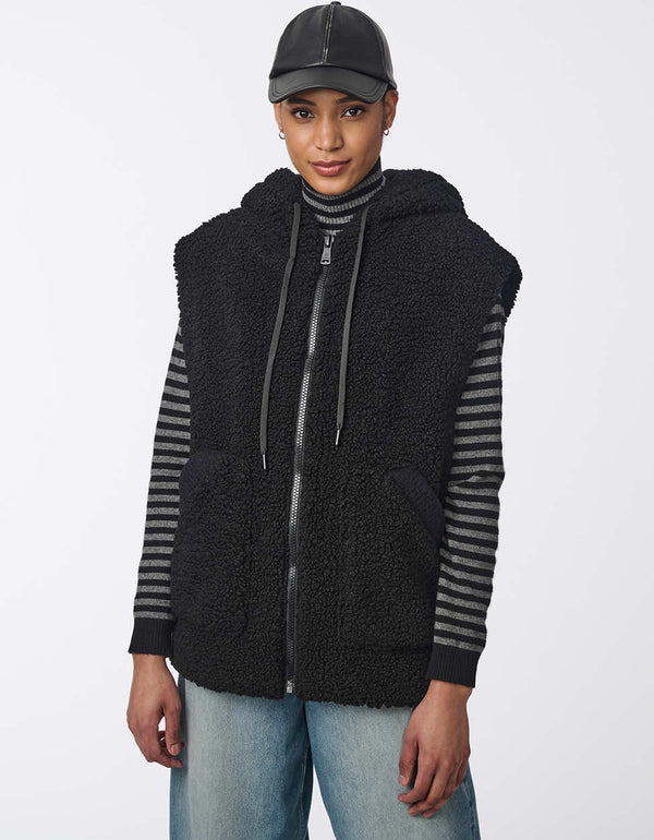 womens sherpa zipped vest for cozy layering style. Keeping you warm in faux fur with an adjustable hood.