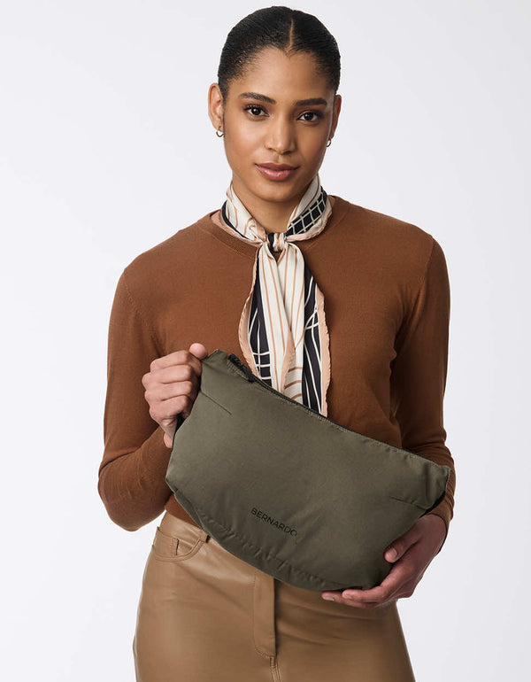 classic cut trench coat in olive green with a matching water resistant travel pouch for women