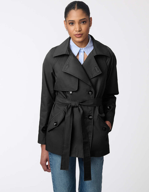 black trench coat for women with an adjustable belt paired with a matching travel pouch