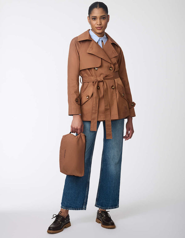 classic fitting brown trench coat for women with an adjustable belt and button up enclosure tortoise buttons