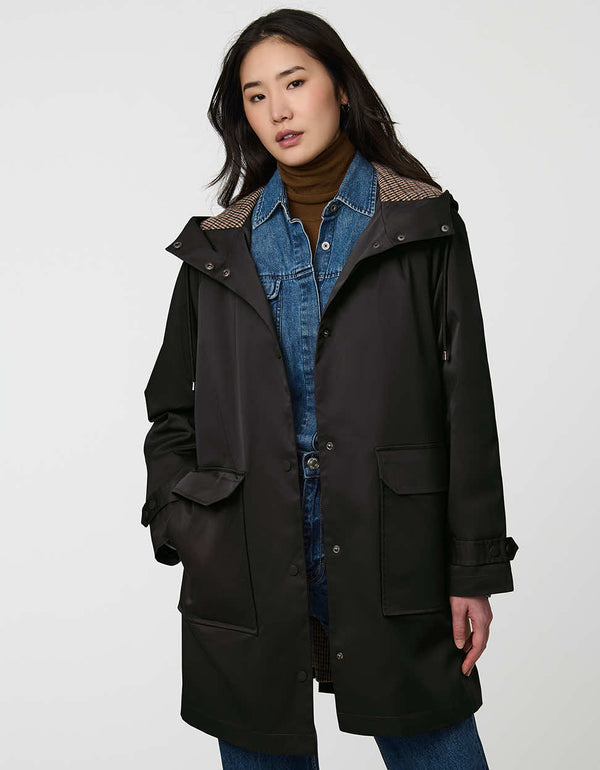 womens knee length black button up two pocket hooded rain coat made from recycled polyester