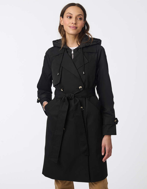 modern classic fitting smart hooded trench coat for women with a removable bib made from water resistant fabric