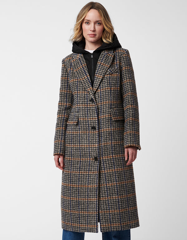 buttoned long wool coat in a classic plaid edgy design equipped with removable bib and hood for versatility