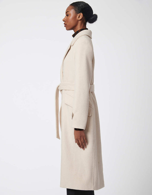 sophisticated and elegantly designed classic wool trench coat with belt in putty cream color for women